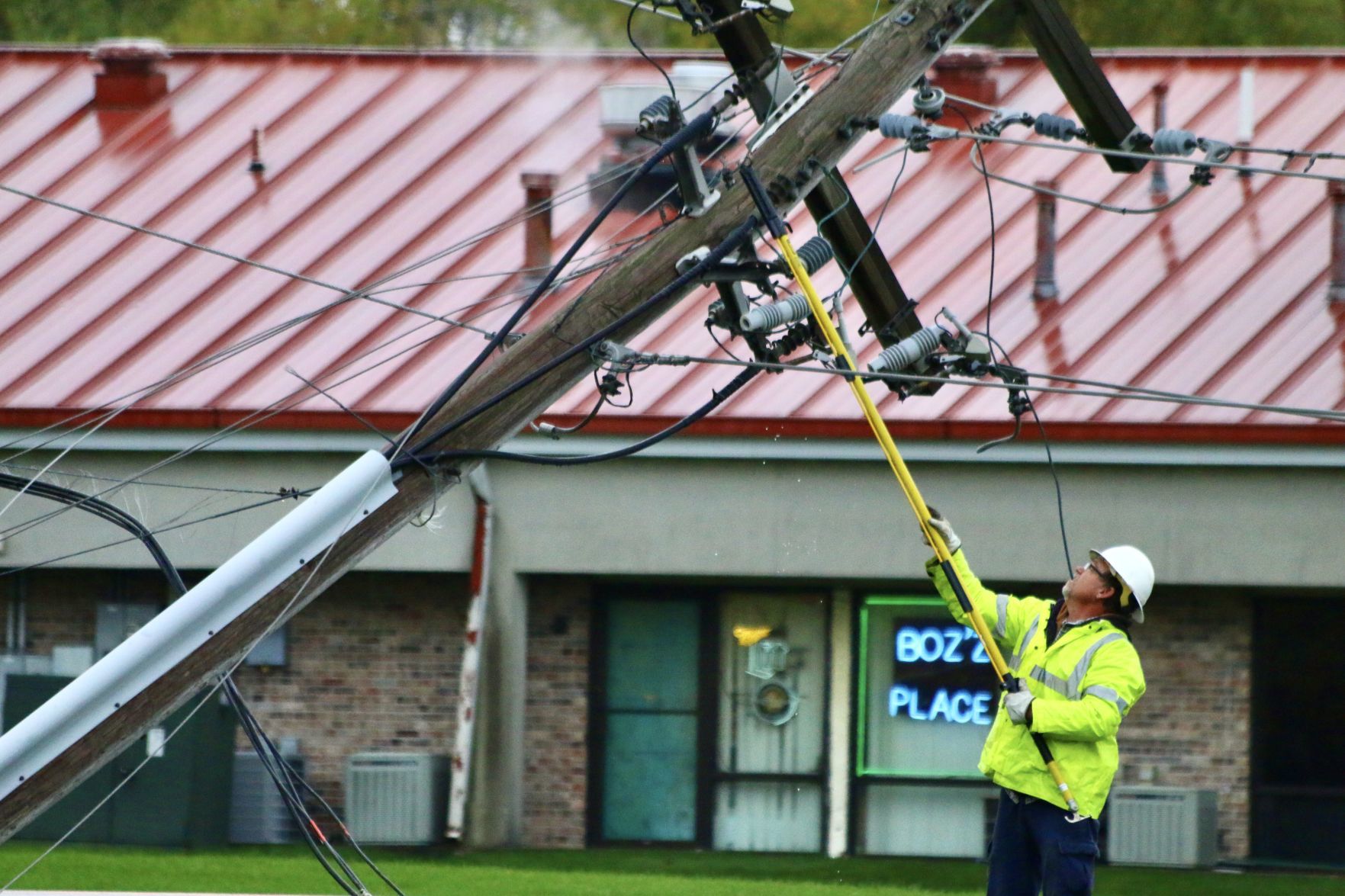 Power poles shear off in chain, knocking out power in Winfield
